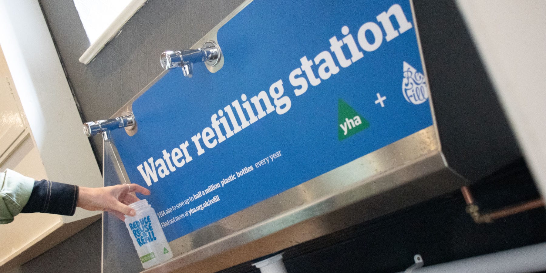 Water refill station with taps