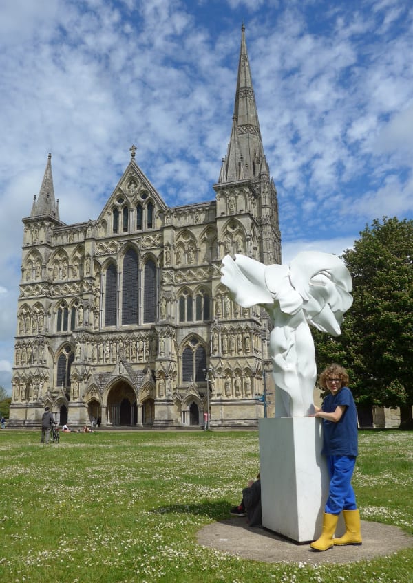 Child by statue in front of Salisbury Cathedral
