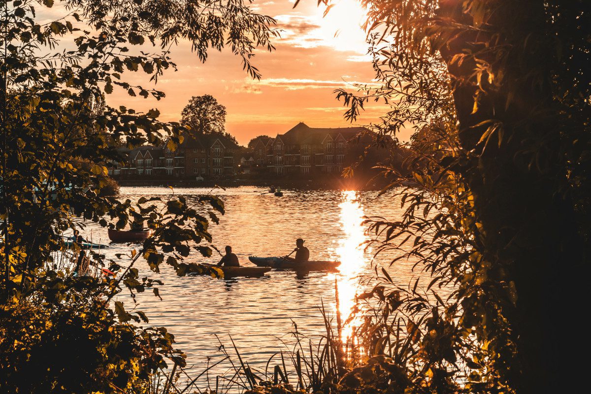 Kayaking on a lake at sunset
