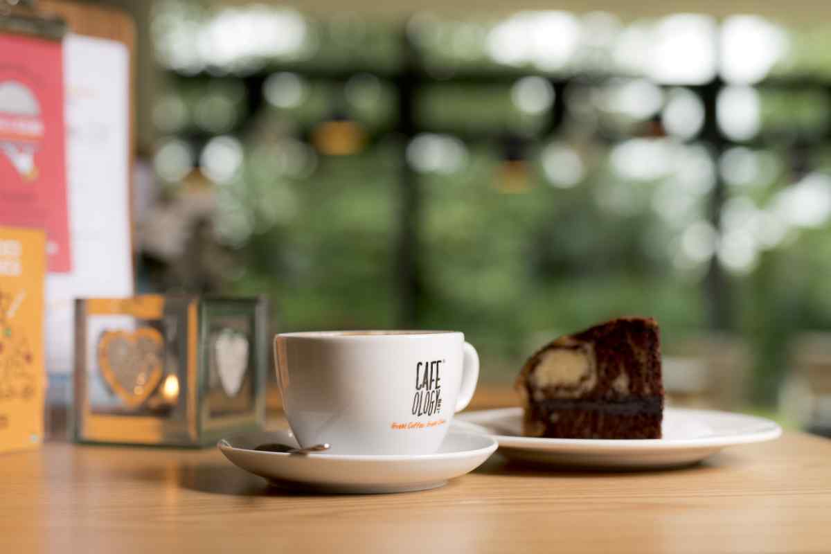 Slice of cake and a cup of tea on a dining table