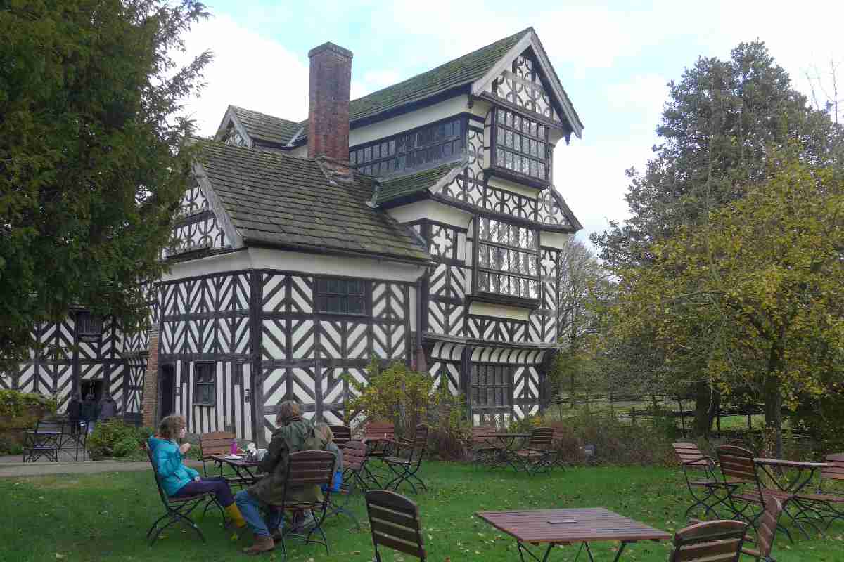 A family sat outside a tudor house in Chester
