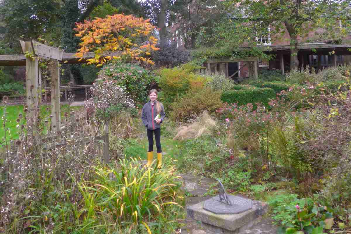 A young girl stood in the garden at YHA Chester Trafford Hall