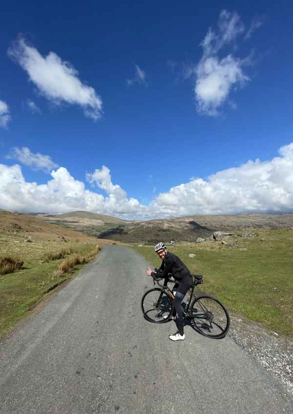 A man cycling in the Lake District