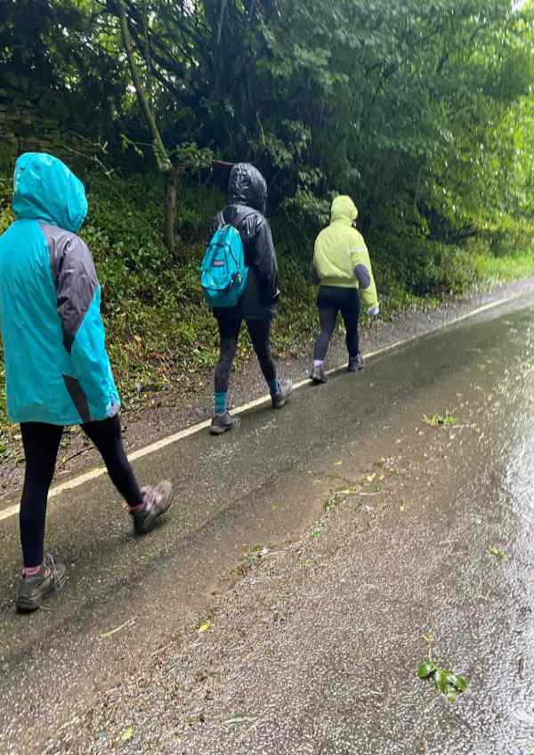 Three girls on a rainy walk in the Peak District