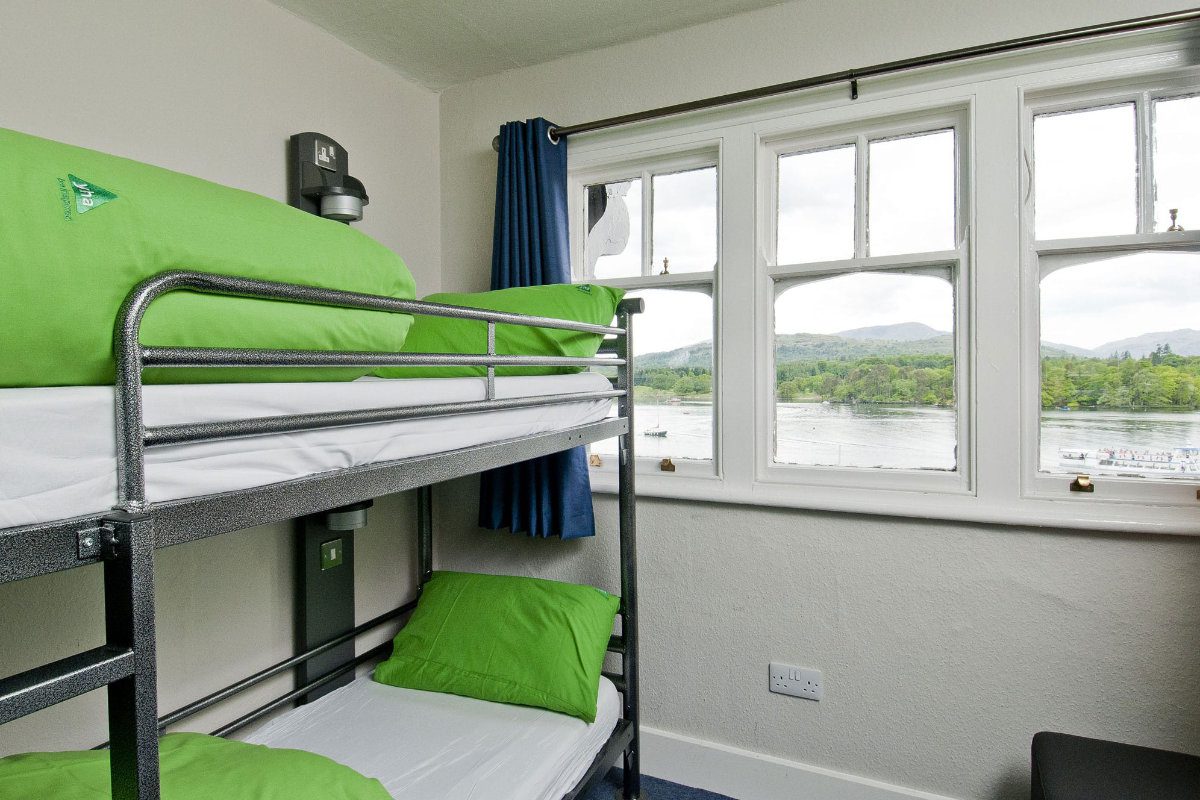 Bedroom with bunk beds and a view over the river at YHA Ambleside