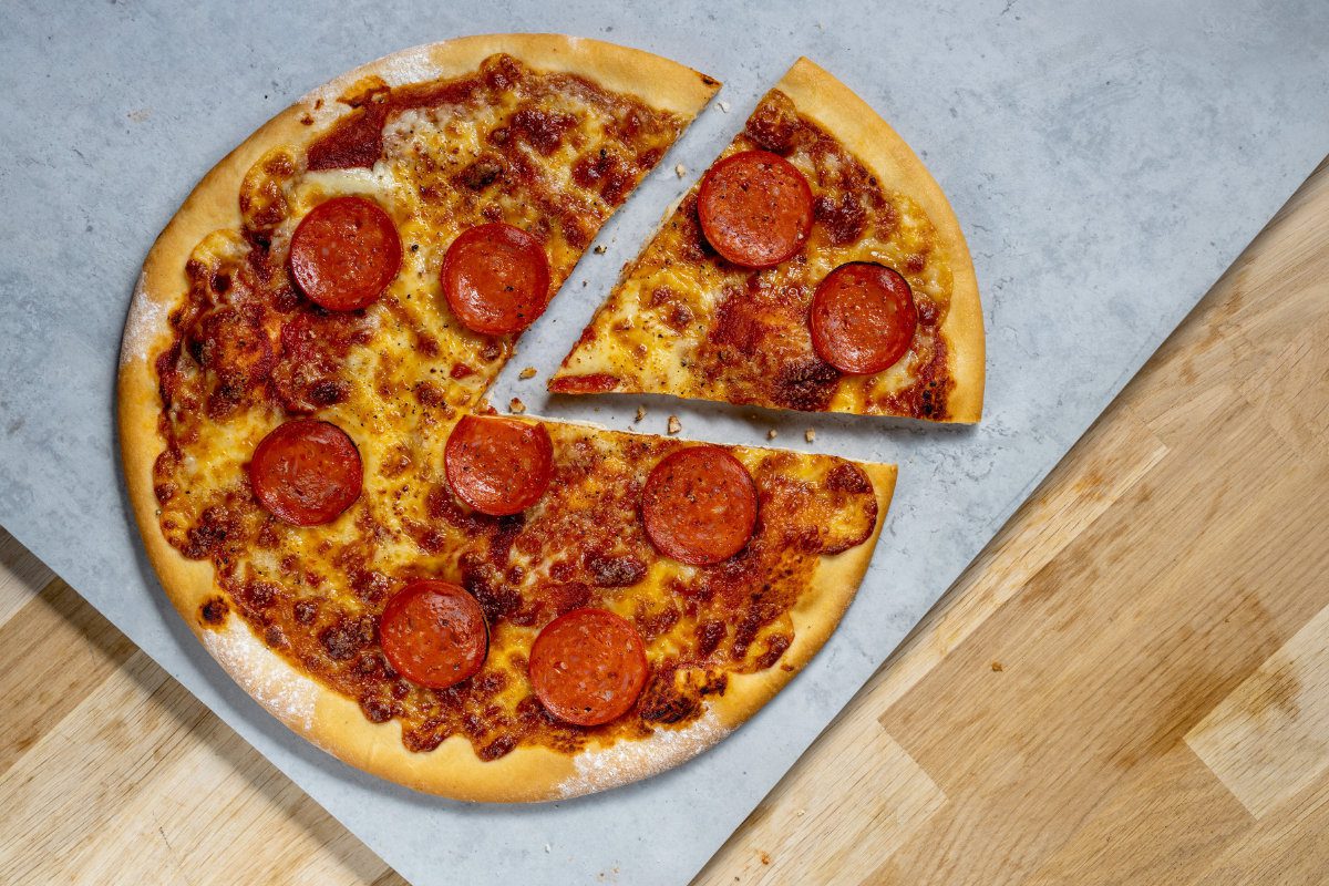 YHA Pizza with slice cut out