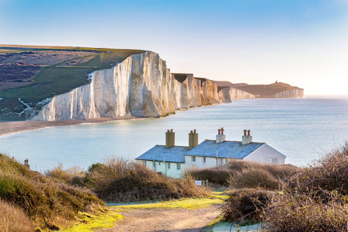 Cottages and white cliffs outside Eastbourne, Sussex